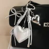 miu series original high-end silver pu heart-shaped bow woven rope bag pendant, keychain all-purpose pendant Specification image